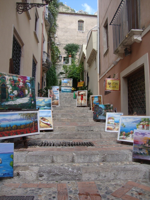 A street in Taormina full of landscape painting