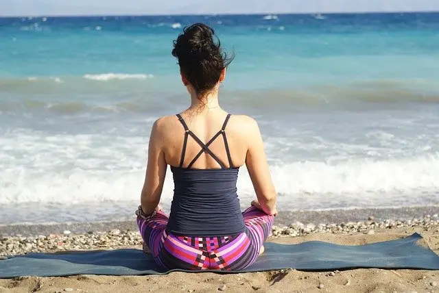 Looking at the beautiful sea doing yoga