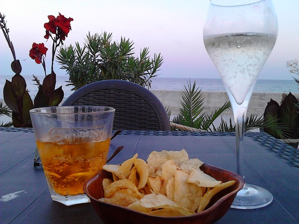 A glass of prosecco and crodino in a seafront bar in Calabria