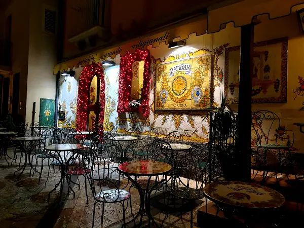 A bar with a ceramic wall panel in Taormina
